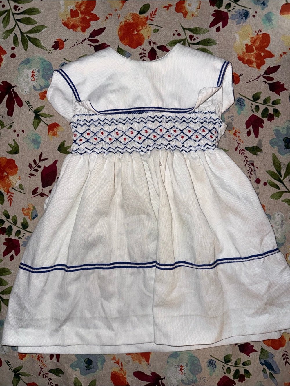 Classic White Smocked Girls' Dress with Navy Trim
